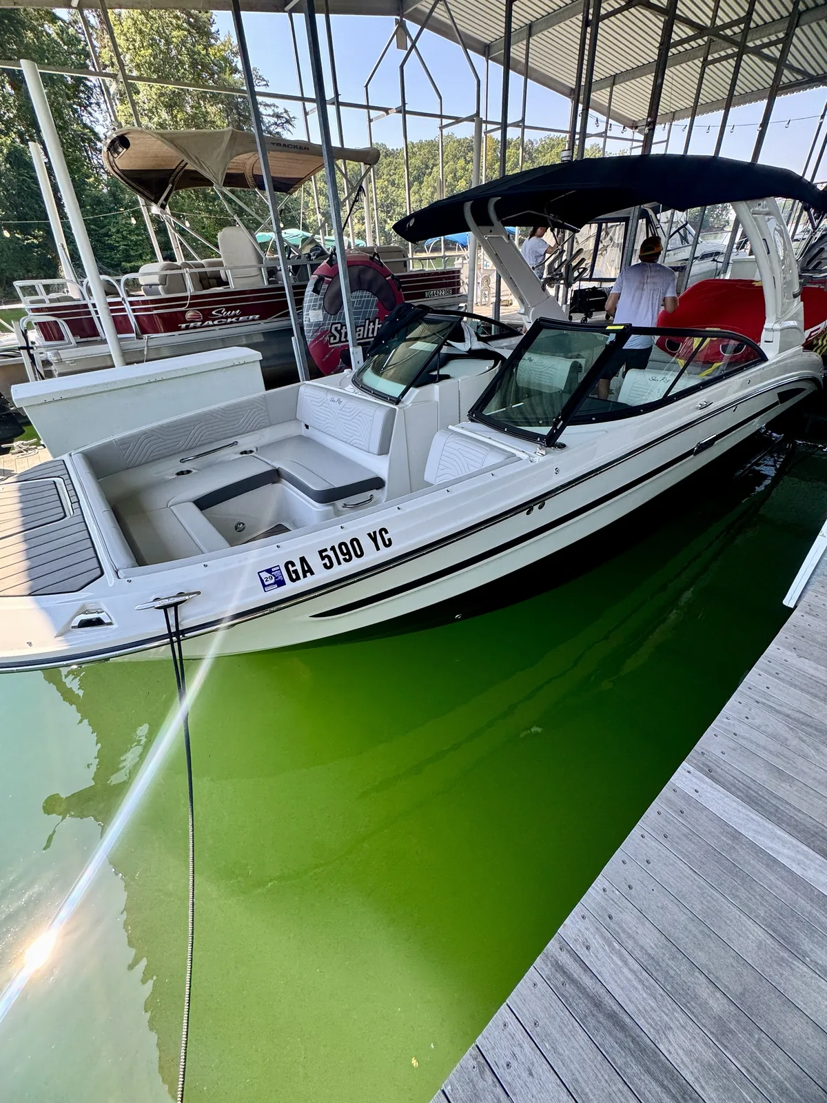 Georgia registration numbers on a Sea Ray bowrider in a covered marina slip